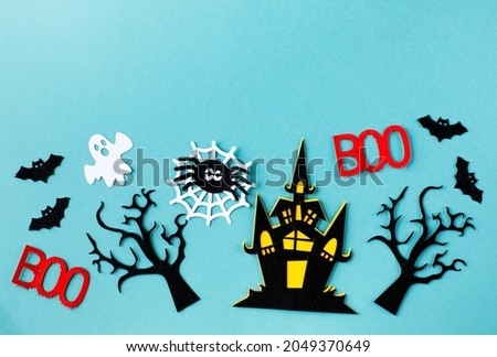 Halloween background. Composition of pumpkin with spooky face delicious candies, decorative elements