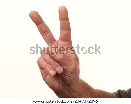 male hand gesturing counts on a white background 2021