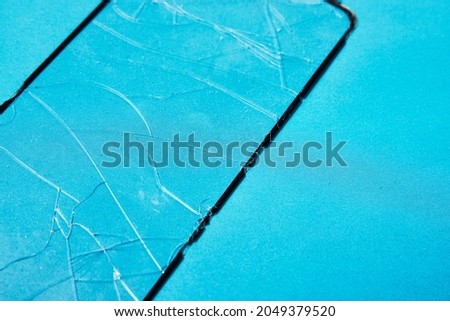 Broken protective glass for mobile phone. Smartphone tempered glass shield
