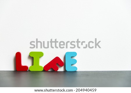 Colorful wooden word life with white background