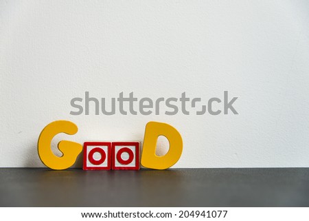 Colorful wooden word Good with white background