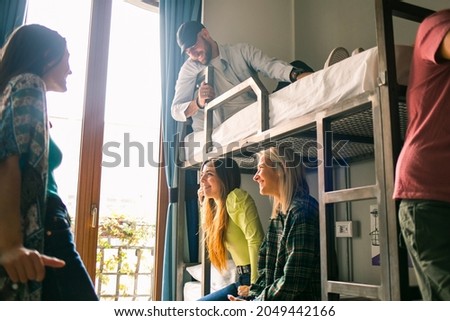 A group of friends in a hostel Royalty-Free Stock Photo #2049442166