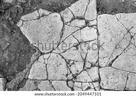 Old aged damaged marble bumpy uneven blocks. Trip pitted grunge granite tile cobble. Cragged grimy retro cranny frayed run track. Crannied dirtied shabby smashed gaping rustic big holes for 3d design Royalty-Free Stock Photo #2049447101