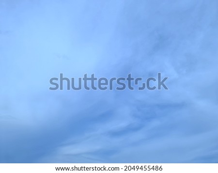 View of beautiful white clouds floating in the blue sky background