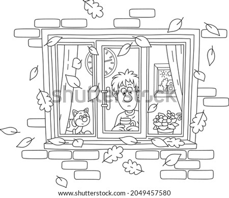 Sad boy and his funny cat looking out of a window with flying autumn leaves, black and white outline vector cartoon illustration for a coloring book page