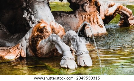 Beautiful fountain with horses in the park