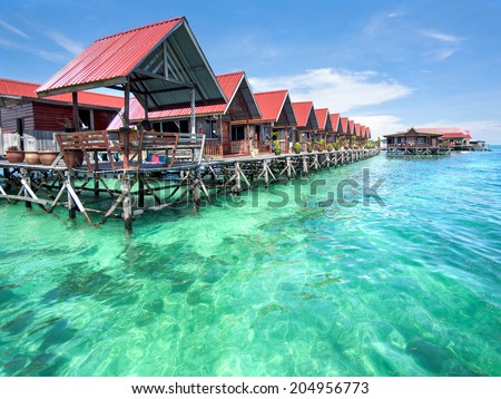 Bungalows on Mabul Island, Sabah, East Malaysia.  Royalty-Free Stock Photo #204956773