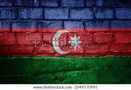 Dark brick wall with the flag