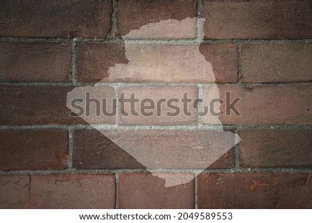 painted map of algeria on a old brick wall