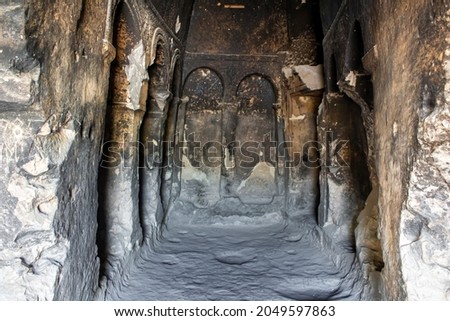Remains of a building built inside a cave thousands of years ago in the Phrygian Valley. Phrygian Valley (Frig Vadisi) is historical region in Ayazini Afyonkarahisar, Turkey. Royalty-Free Stock Photo #2049597863