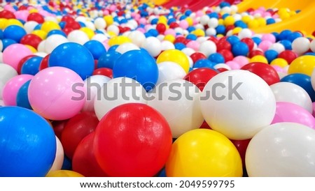 colorful plastic balls in children's playground.