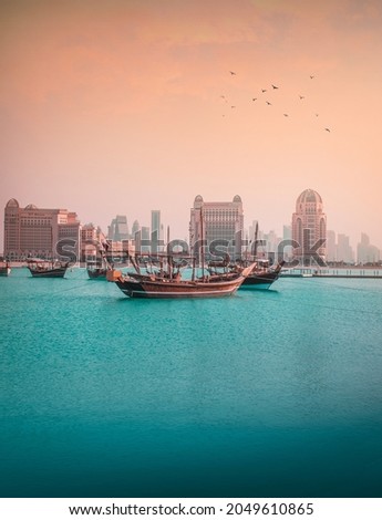 Beautiful shot of a typical arabic boat in the center of Doha, Qatar, during sunset Royalty-Free Stock Photo #2049610865