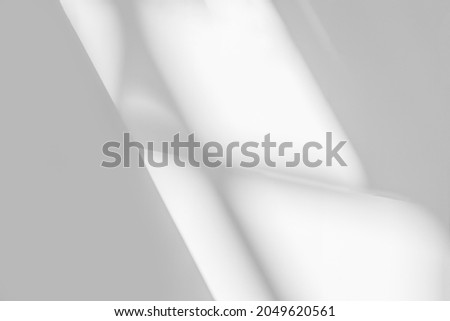 Gray shadow and light blur abstract background on white wall  from window,  architecture dark shadows indoor in room  background, monochrome, black and white

