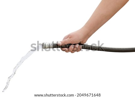 Female Woman's hand holding running water black garden hose on isolated white background Royalty-Free Stock Photo #2049671648