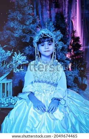 portrait of the child of the snow queen in the crown. fairy tale concept