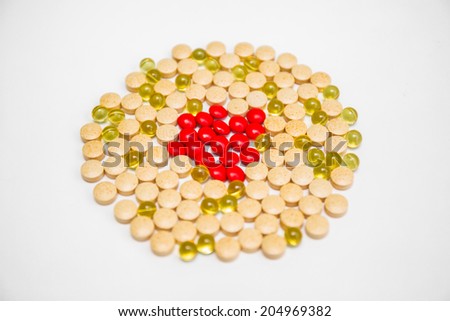 Medical pills and vitamin capsules on white background 