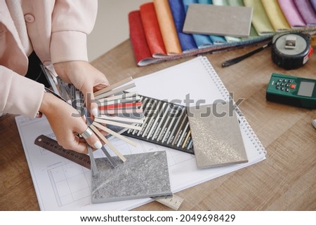 Closeup Selection of color of epoxy grout for ceramic tiles. Concept work of interior designer. Royalty-Free Stock Photo #2049698429