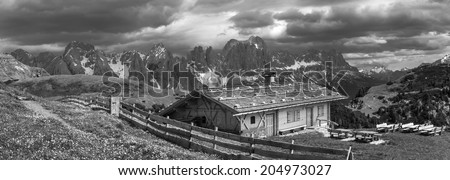 Black and white photo of an alpine hut at Schlern mountain, South Tyrol, Italy.