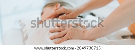 doctor osteopath hands does physiological and emotional therapy for eight year old kid girl. pediatric osteopathy treatment session. alternative medicine. taking care of the child's health. banner Royalty-Free Stock Photo #2049730715