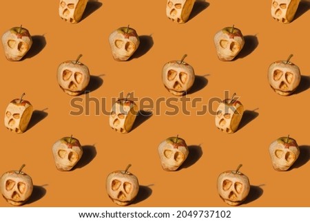 Orange Halloween seamless pattern, natural shrunken apple heads  