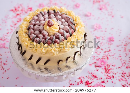 Delicious cake with fresh raspberries