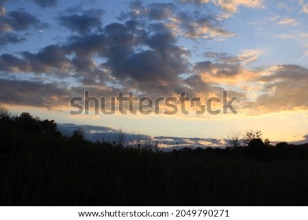 sunset and cloudy skies in autumn.