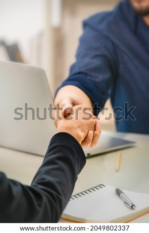 Business partnership coorperation concept. closeup of business handshaking. Successful and trust businessmen handshaking after agreement negotiation deal Royalty-Free Stock Photo #2049802337