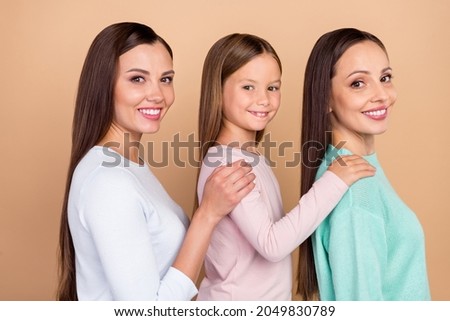 Profile side photo of cheerful happy family woman good mood hand shoulder care isolated on beige color background
