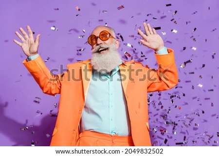 Photo of cheerful positive joyful cool old man confetti fall look copyspace dream isolated on violet color background Royalty-Free Stock Photo #2049832502