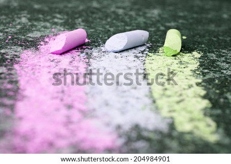 three colored stripes, drawing with chalk on asphalt, selective focus