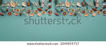 Top view image of autumn forest natural composition over green background .Flat lay