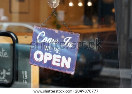 come in open boutique text sign board on windows shop restaurant cafe store signboard