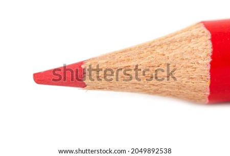 Red pencil isolated on a white background. Close-up
