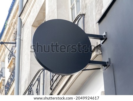 Circular store brand sign board mockup. Empty rounded shop frontage in street