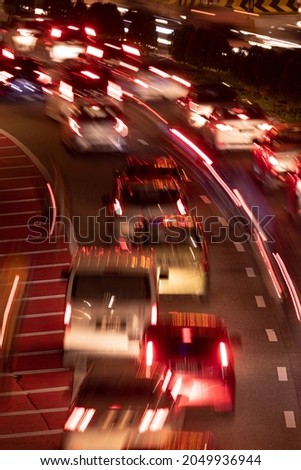 Long exposure photograph of night traffic and traffic jams in the city of Kuala Lumpur, Malaysia, seen from the bridges over Kuching Street