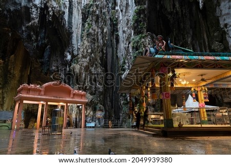 Ornate and polychrome Hindu temples inside the Batu Caves, a famous place of worship and pilgrimage north of Kuala Lumpur, Malaysia