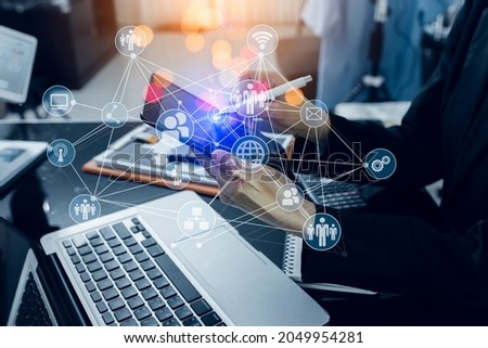 Double exposure of Businesswoman hands working on tablet computer with network digital finance marketing chart and future technology innovation and digital transformation concept. Blurred background.