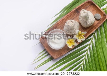 SPA concept: composition of spa treatment on green palm background 

