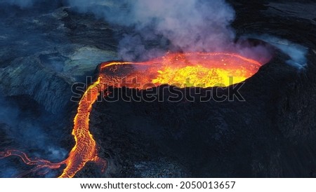 Aerial view over lava eruption, Mount Fagradalsfjall active, iceland
4K drone shot of lava spill out of the crater  Mount Fagradalsfjall, September 2021, Iceland 
