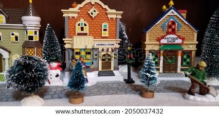 Miniature Christmas village scene with small houses Royalty-Free Stock Photo #2050037432