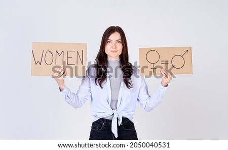 Attractive young woman protester for gender equality.
