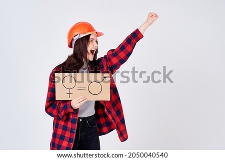 Female construction worker protesting for gender equality.