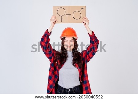 Cheerful cute female construction worker for gender equality.