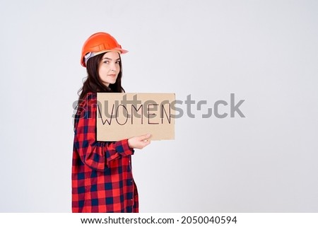 Pretty female construction worker, feminist, supports women.