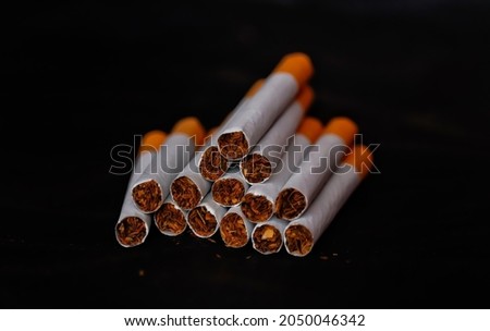 Cigarette on black background,smooth addiction,world No Tobacco Day concept with selective focus