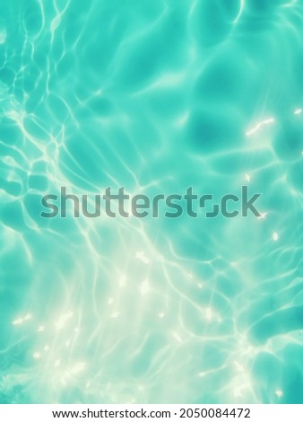 Abstract​ on surface​ blue​ water​ for​ background. Closeup​ blur​ abstract​ for​ background.