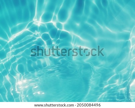 Abstract​ on surface​ blue​ water​ for​ background. Closeup​ blur​ abstract​ for​ background.