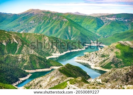 Beautiful blue green Kozjak lake surrounded by hills in the mountains of North Macedonia. Large artificial lake. Breathtaking panoramic view Royalty-Free Stock Photo #2050089227