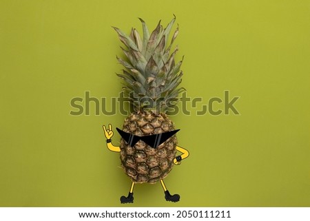 Swag. Creative artwork. Contemporary art collage of pineapple, rock singer isolated over green background. Drawn body pieces. Concept of funny meme emotions, humor, health, food. Copy space for ad