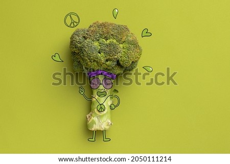 Healthy eating. Vegetables. Contemporary art collage. Funny hipster broccoli isolated over green background. Concept of funny meme emotions, humor, health, food. Copy space for ad